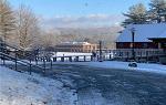 Snowy image of Bridges exterior looking down toward lower campus.