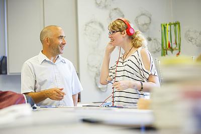  A student and professor talking.