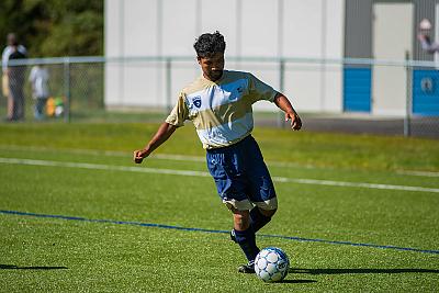 Landmark College soccer player kicks ball